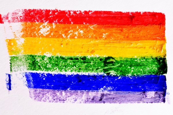 rainbow flag painted in a textured background
