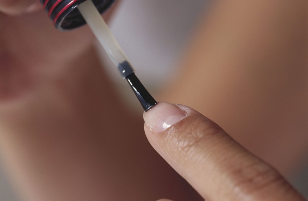 Close-up of a person applying nail polish